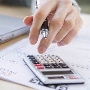 Hand using a calculator