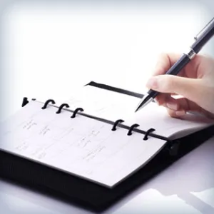 Hand writing in a notebook